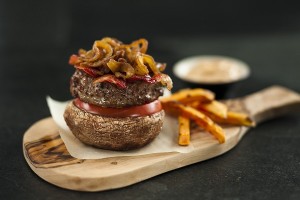 Portabello Mushroom, Grass-Fed Beef Burger served with Carmelized Onions, Beef Bacon and Sweet Potato Fries